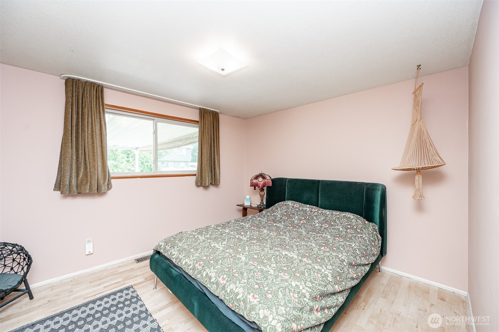 9116 121st Street Southwest Lakewood, WA 98498 - Photo 10 of 24 a bedroom with a bed and a window