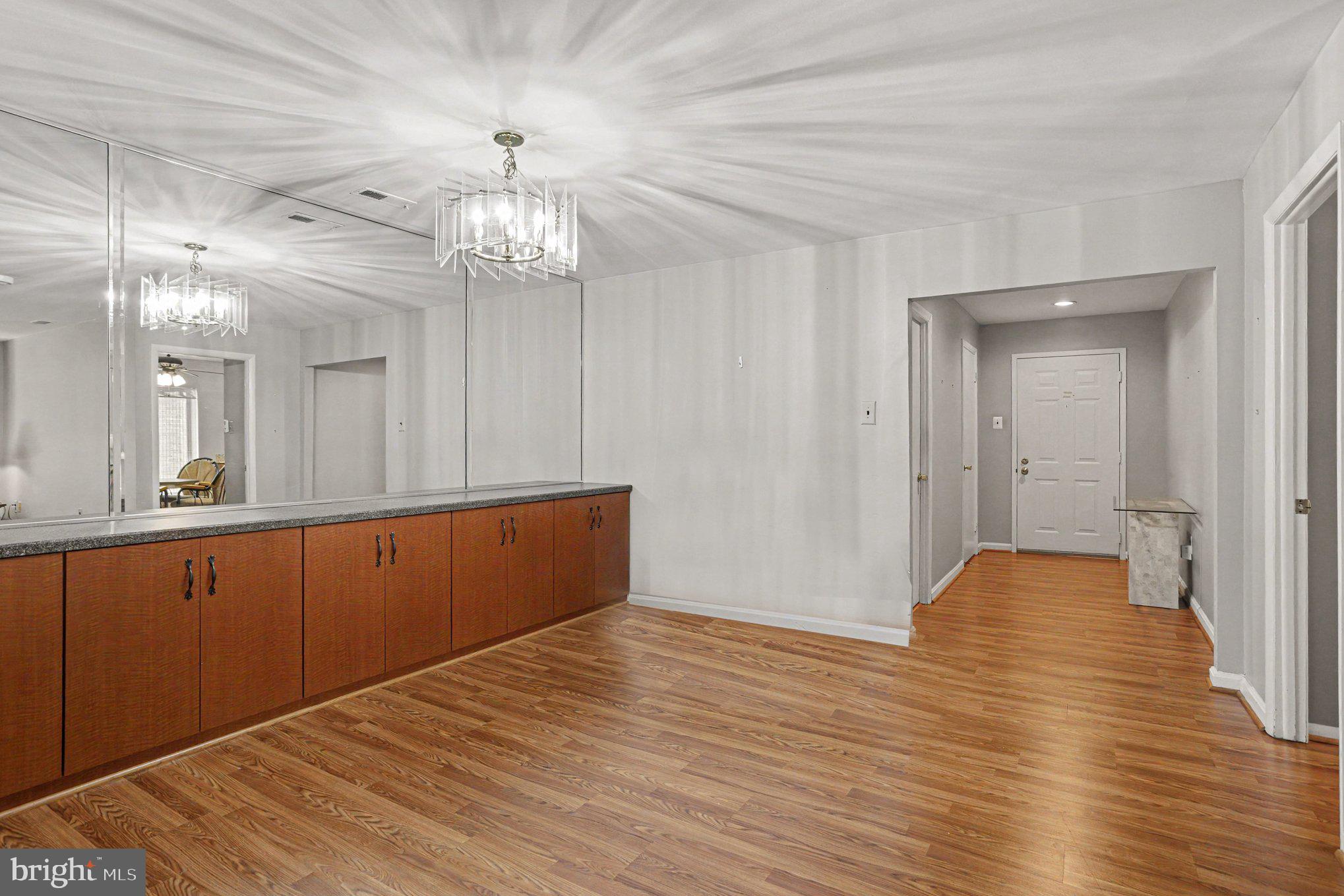 3021 Fallstaff Road, Unit 208B Baltimore, MD 21209 - Photo 8 of 25 a view of livingroom with hardwood floor and hallway
