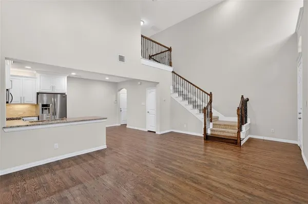 a view of a living room and wooden floor