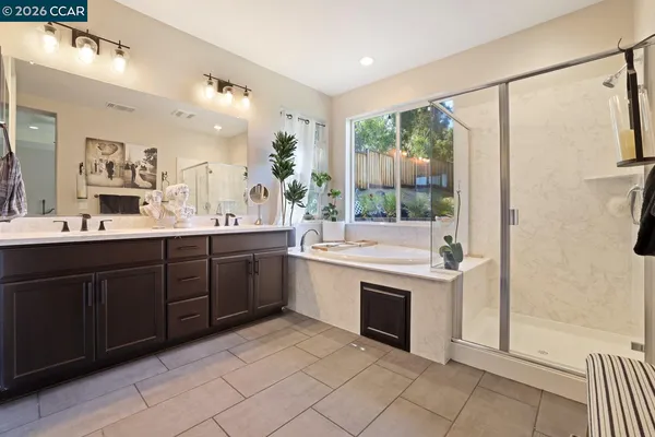 a view of a chair and tables in the backyard