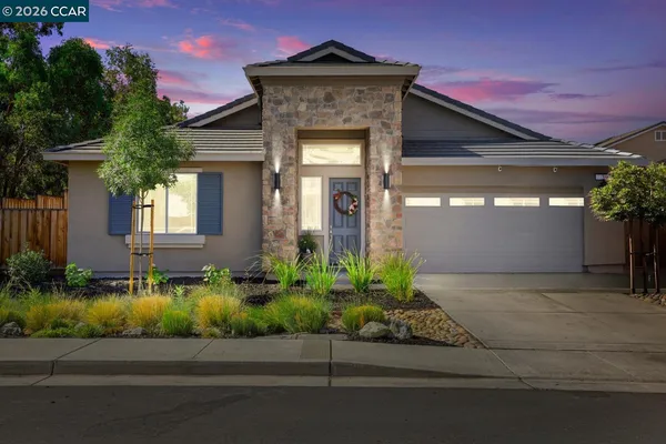 front view of a house with a small yard