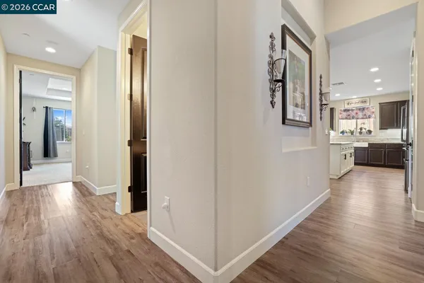a large kitchen with lots of counter space a sink appliances and dining table