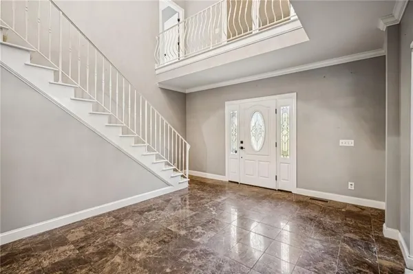 wooden floor in an empty room with a fireplace