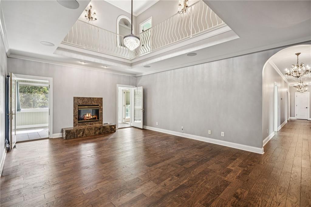 181 Granny Smith Circle Clarkesville, GA 30523 - Photo 15 of 79 wooden floor in an empty room with a fireplace