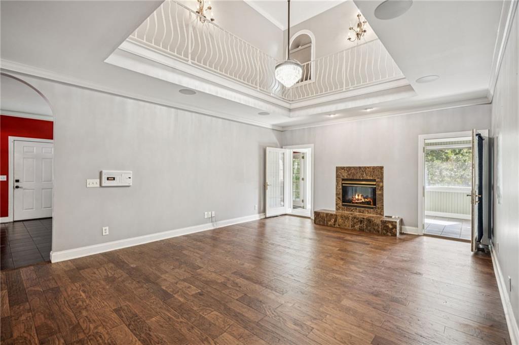 181 Granny Smith Circle Clarkesville, GA 30523 - Photo 16 of 79 an empty room with wooden floor and windows