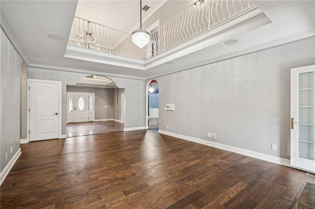 181 Granny Smith Circle Clarkesville, GA 30523 - Photo 17 of 79 a view of an empty room with wooden floor and a window