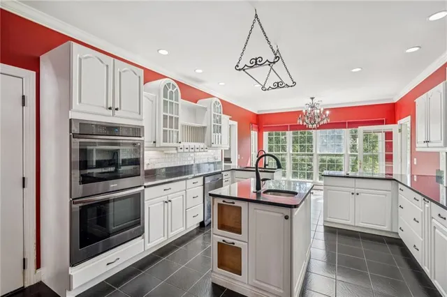 a view of livingroom with furniture fan and window