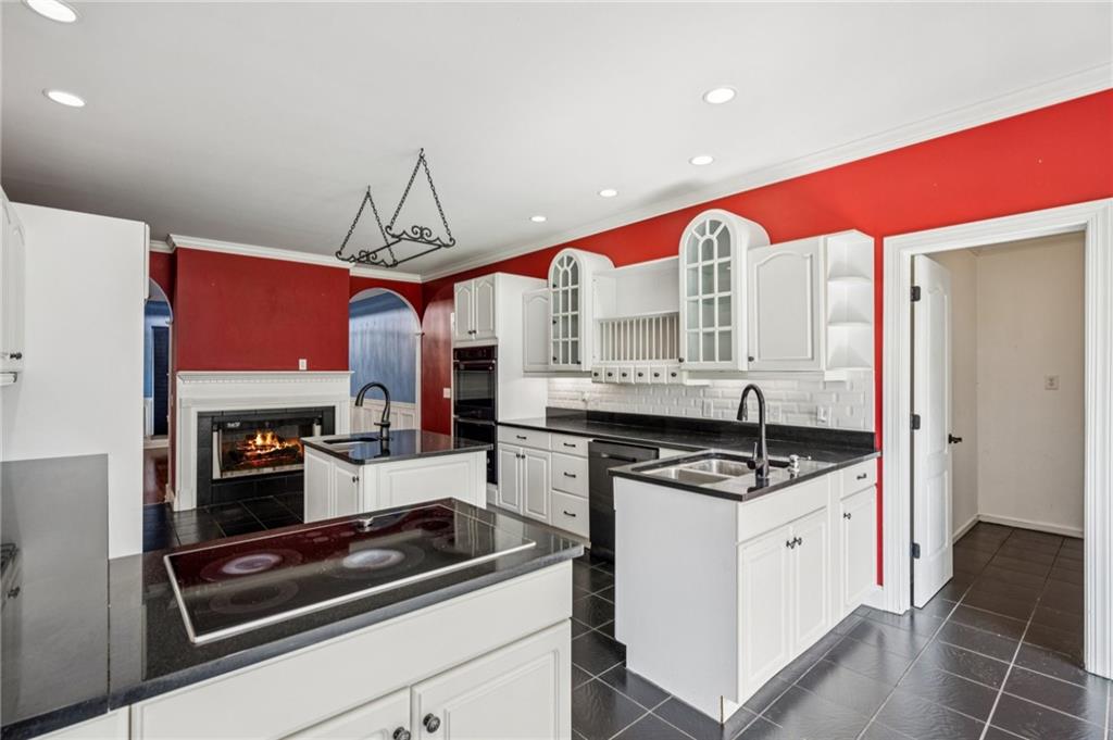 181 Granny Smith Circle Clarkesville, GA 30523 - Photo 20 of 79 a kitchen with stainless steel appliances granite countertop a stove and a refrigerator