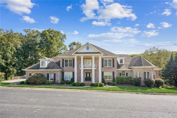 a front view of a house with a yard