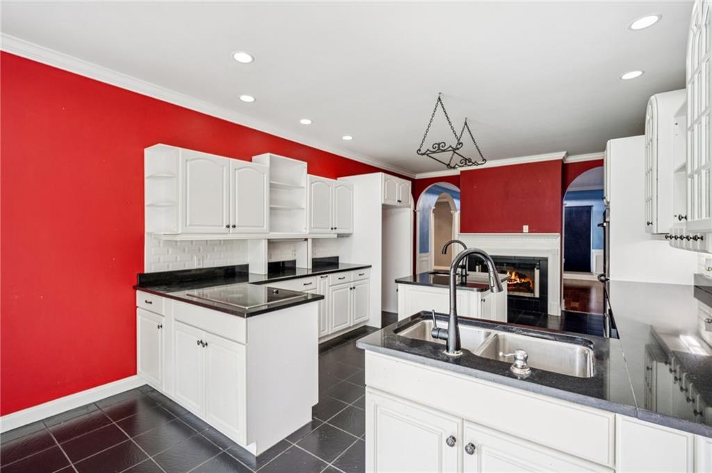 181 Granny Smith Circle Clarkesville, GA 30523 - Photo 21 of 79 a kitchen with stainless steel appliances granite countertop a sink and cabinets