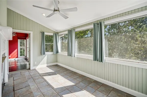 a bathroom with a granite countertop sink and mirror