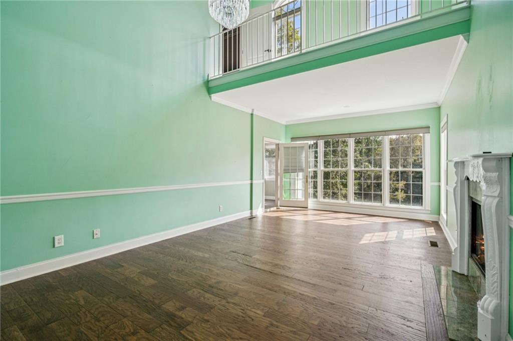 181 Granny Smith Circle Clarkesville, GA 30523 - Photo 30 of 79 a view of an empty room with a window and wooden floor