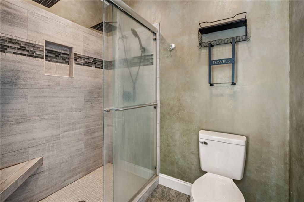 181 Granny Smith Circle Clarkesville, GA 30523 - Photo 33 of 79 a bathroom with a toilet and a shower