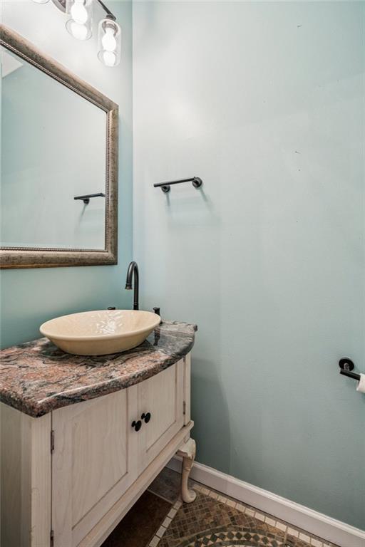 181 Granny Smith Circle Clarkesville, GA 30523 - Photo 35 of 79 a bathroom with a granite countertop sink and mirror