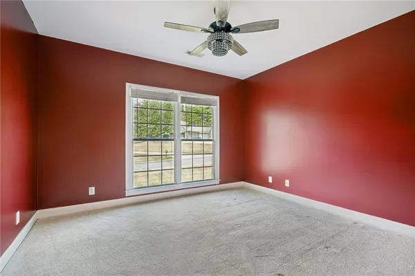 a bathroom with a toilet a sink and a mirror
