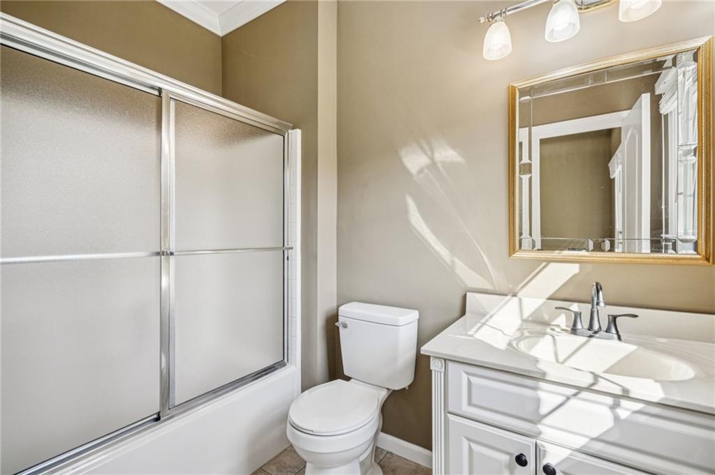 181 Granny Smith Circle Clarkesville, GA 30523 - Photo 43 of 79 a bathroom with a sink a toilet a mirror and shower