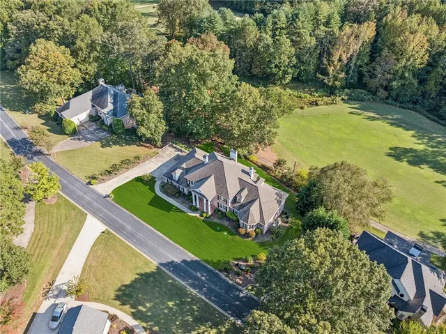 an aerial view of a house with a garden