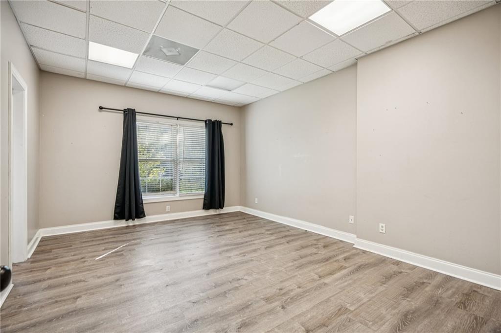 181 Granny Smith Circle Clarkesville, GA 30523 - Photo 63 of 79 an empty room with wooden floor and windows