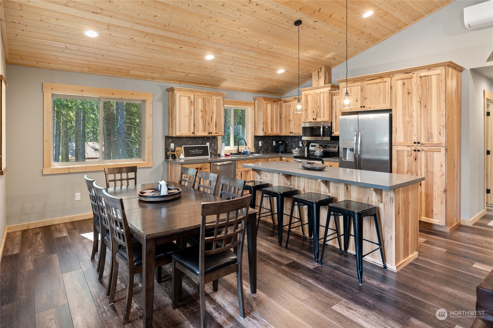 230 Easy Street Ronald, WA 98940 - Photo 18 of 40 a kitchen with stainless steel appliances granite countertop a dining table chairs refrigerator and sink
