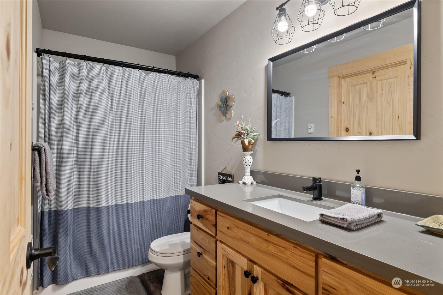 230 Easy Street Ronald, WA 98940 - Photo 30 of 40 a bathroom with a sink a toilet and shower curtain