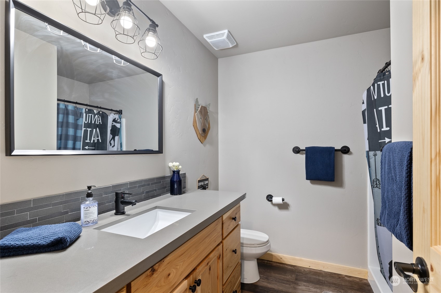 230 Easy Street Ronald, WA 98940 - Photo 35 of 40 a bathroom with a granite countertop sink vanity mirror and toilet
