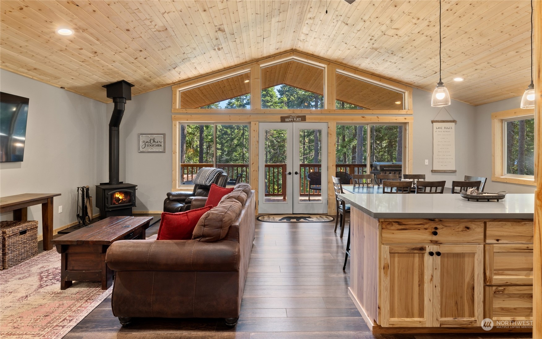 230 Easy Street Ronald, WA 98940 - Photo 8 of 40 a living room with furniture a flat screen tv and a floor to ceiling window