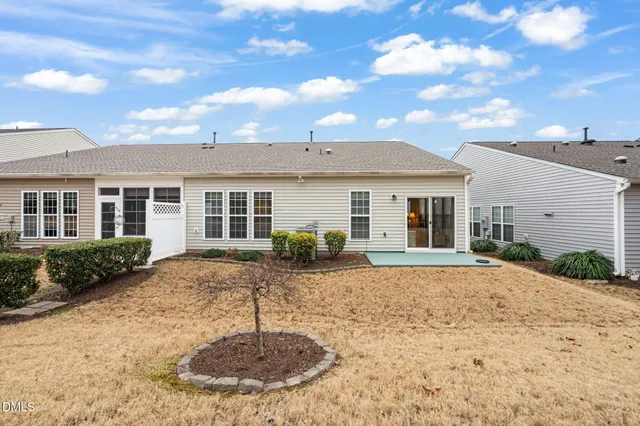 a view of a patio with table and chairs and potted plants