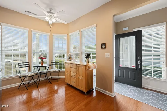 a view of a livingroom with furniture window and wooden floor