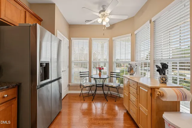 a view of a livingroom with furniture window and wooden floor