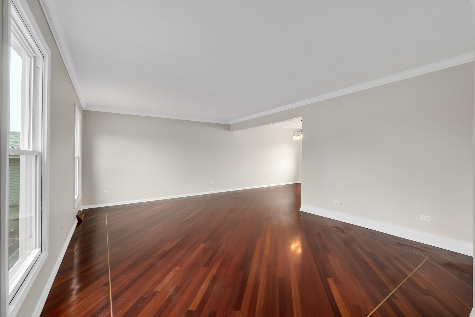 7804 Rohrer Drive Downers Grove, IL 60516 - Photo 4 of 28 a view of wooden floor and windows in a room