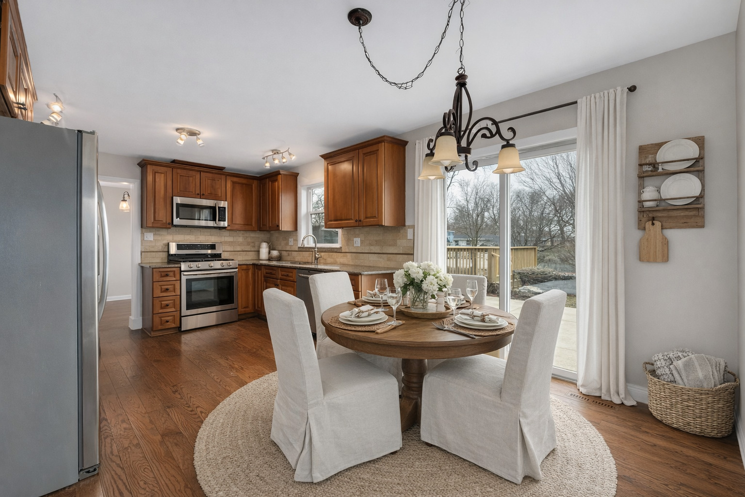 7804 Rohrer Drive Downers Grove, IL 60516 - Photo 6 of 28 a dining room with furniture a chandelier and wooden floor
