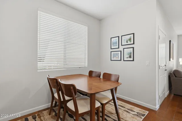 a dining room with furniture and window
