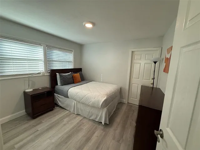 a bedroom with a bed and a closet