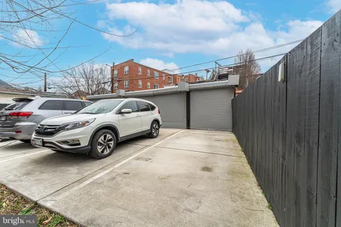 a view of a car in front of a building