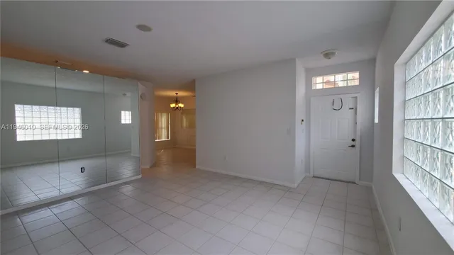 a view of an empty room and window