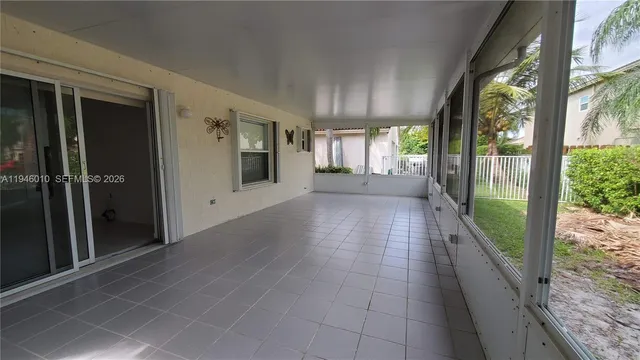 a view of a porch with wooden floor and stairs