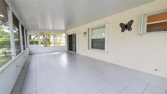 a view of an entryway with wooden floor and windows