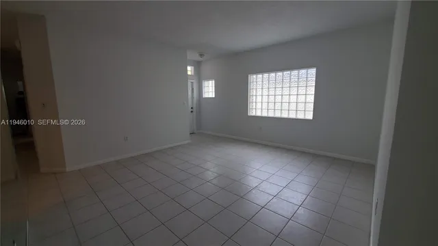a view of an empty room and window