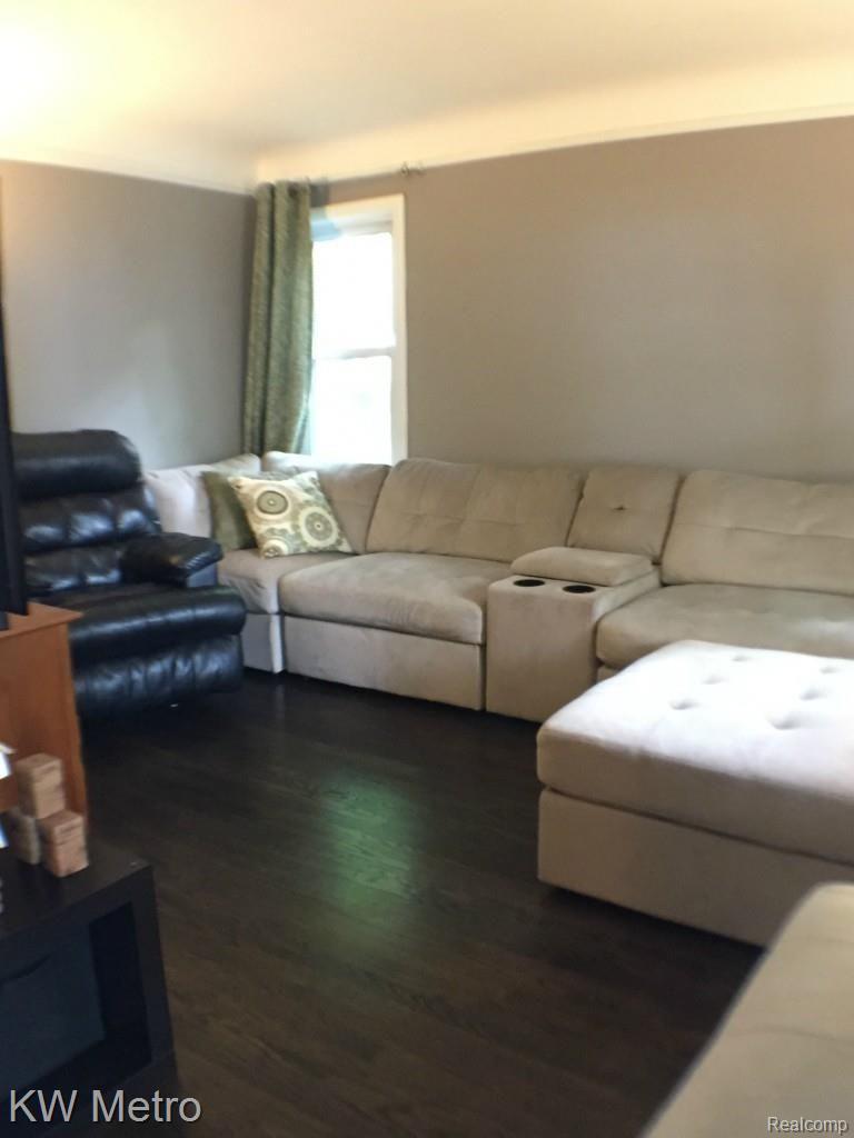 1705 Harvard Road Berkley, MI 48072 - Photo 9 of 30 Freshly painted living room w/dark hardwood floors. Newer windows
