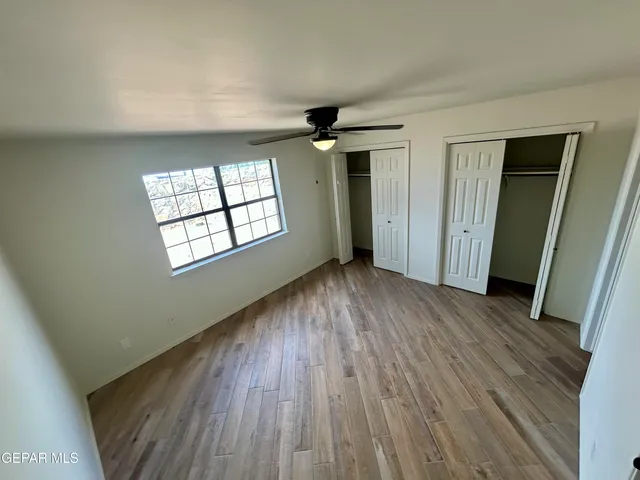 a bathroom with a granite countertop toilet a sink and bathtub