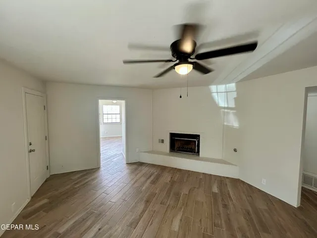 a bathroom with a granite countertop sink a shower and a mirror