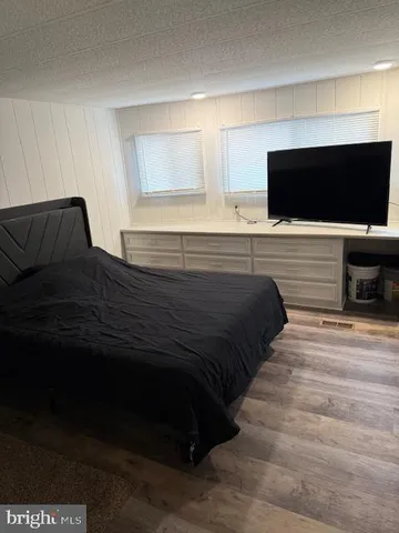 a room with gym equipment and a mirror