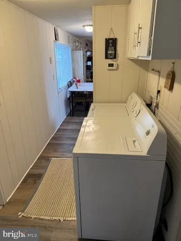 a bedroom with a bed and flat screen tv