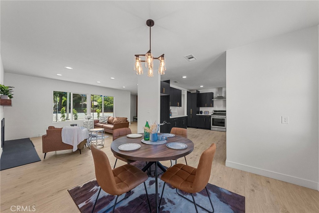 4881 Arlington Avenue Riverside, CA 92504 - Photo 11 of 37 a view of a dining room with furniture window and outside view