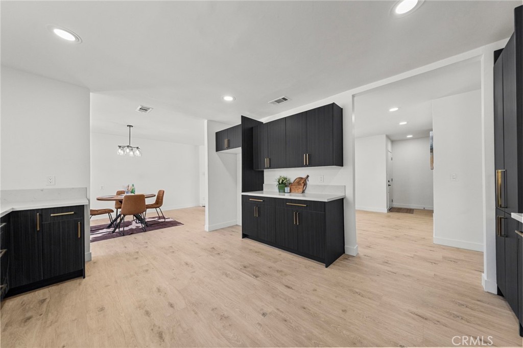 4881 Arlington Avenue Riverside, CA 92504 - Photo 16 of 37 a living room with furniture and a flat screen tv