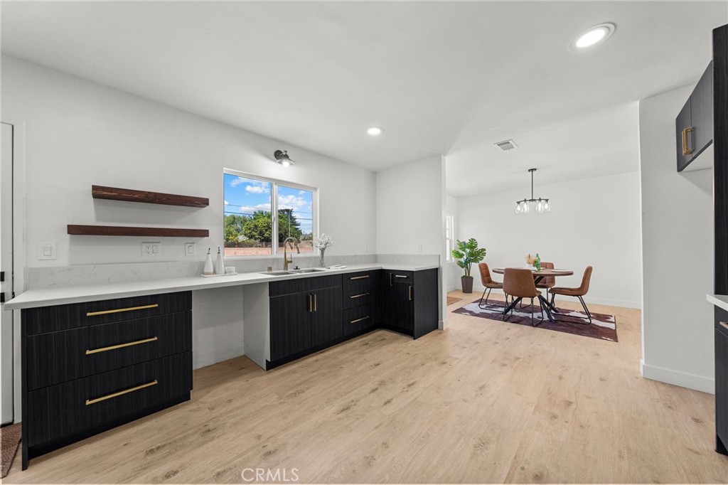 4881 Arlington Avenue Riverside, CA 92504 - Photo 17 of 37 a kitchen with a sink and cabinets
