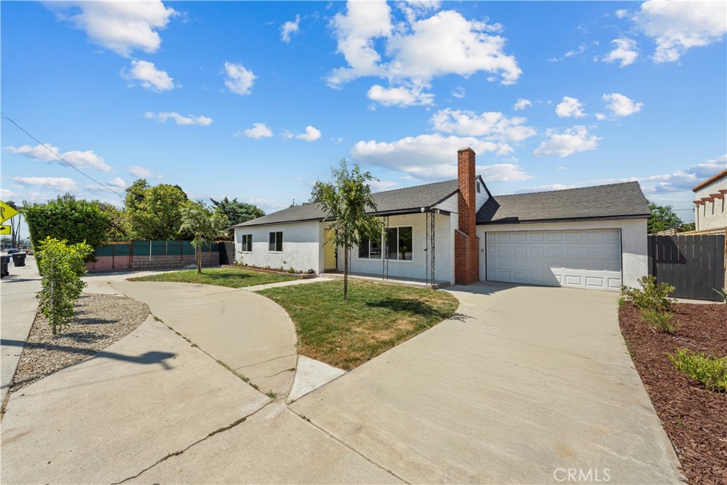 4881 Arlington Avenue Riverside, CA 92504 - Photo 2 of 37 a front view of a house with garden