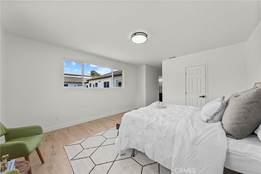 4881 Arlington Avenue Riverside, CA 92504 - Photo 21 of 37 a bedroom with a bed and a couch