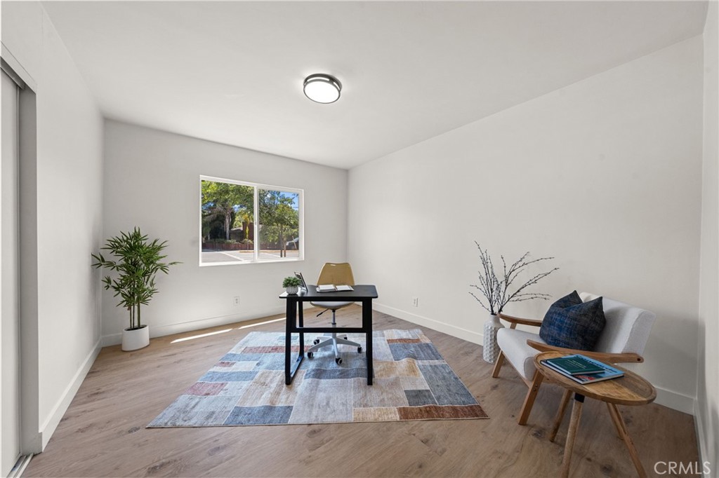 4881 Arlington Avenue Riverside, CA 92504 - Photo 24 of 37 a living room with furniture and a potted plant