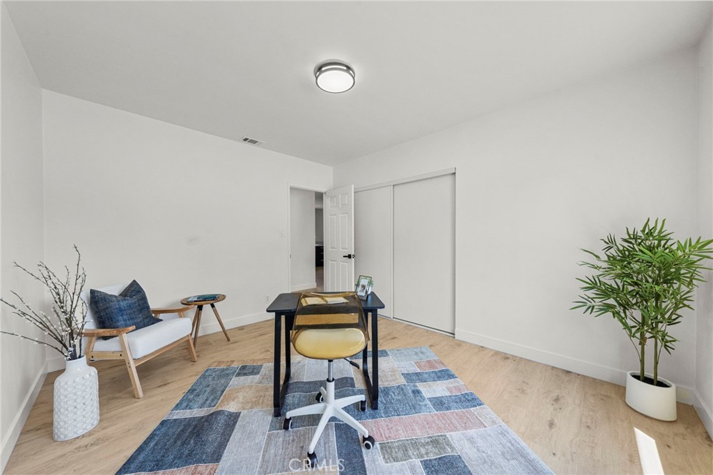 4881 Arlington Avenue Riverside, CA 92504 - Photo 25 of 37 a view of a livingroom with furniture and wooden floor